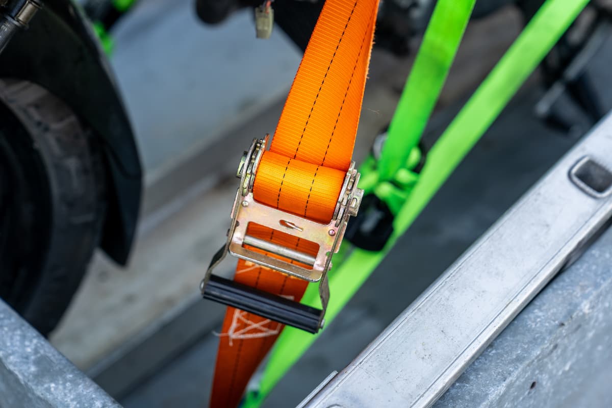 You are currently viewing How to Safely Transport a Motorcycle (Trailer Tie-Down Guide)